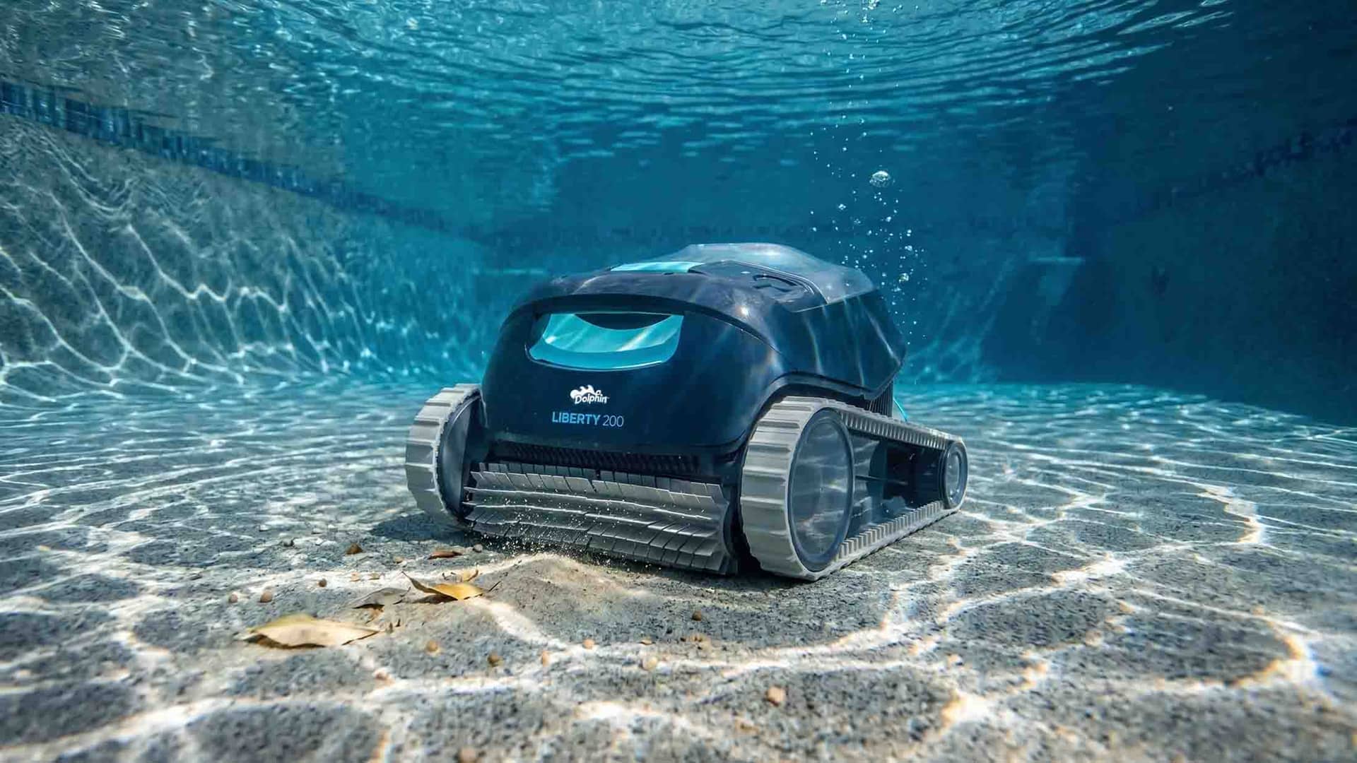 Dolphin Liberty 200 cordless robotic pool cleaner cleaning a sandy pool floor with no cable